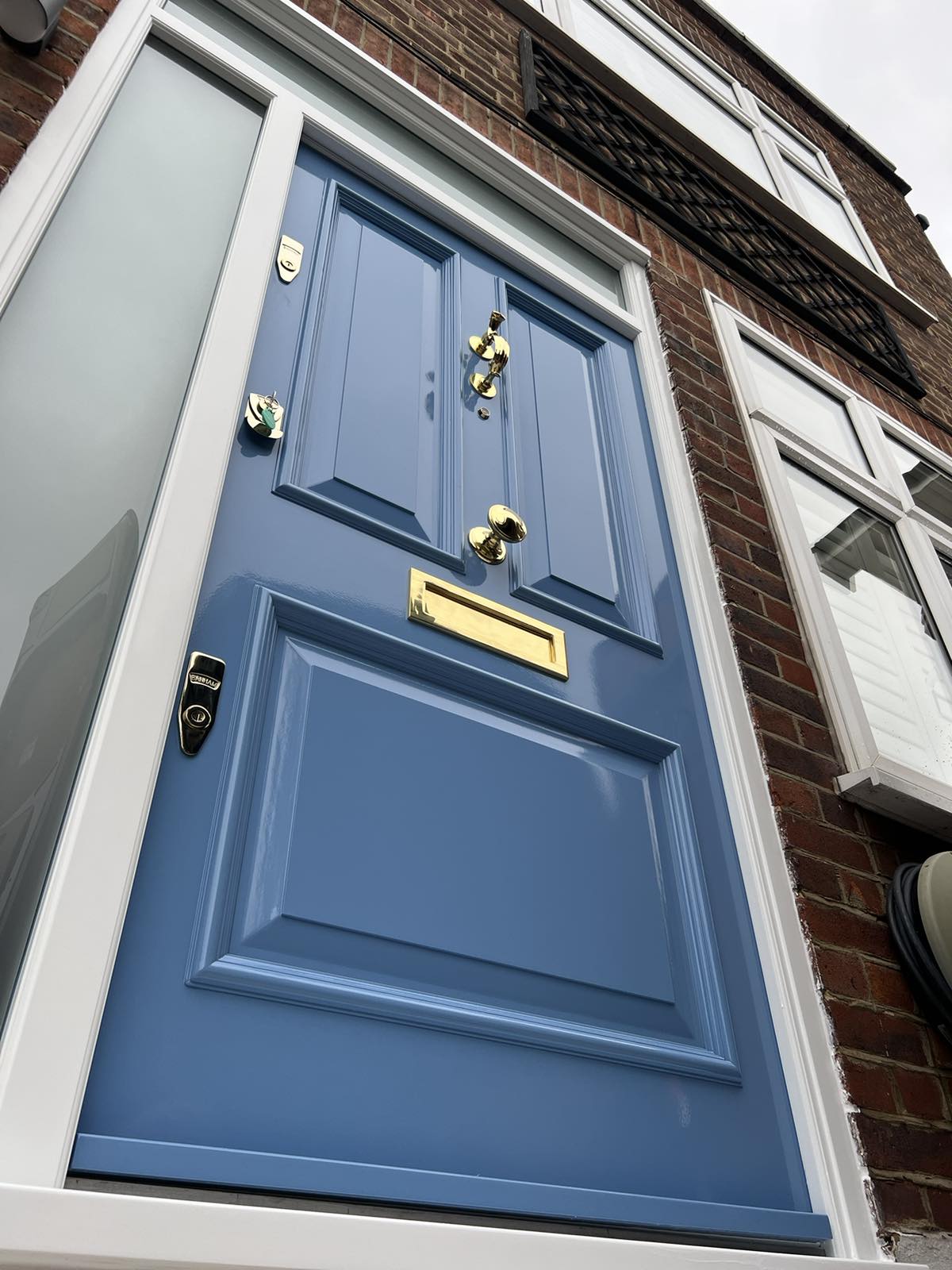 Blue front door with sidelights