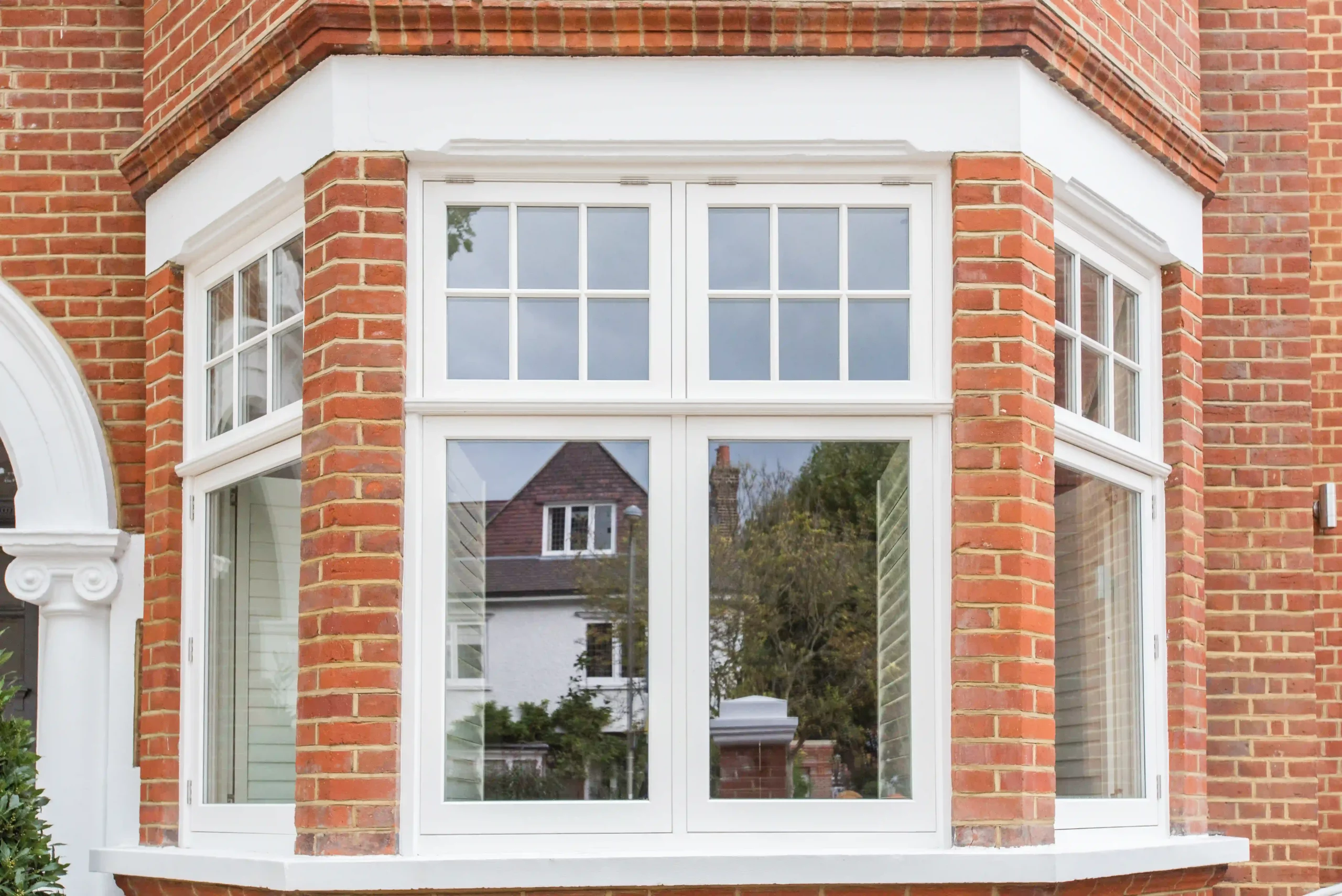 Brick bay with white 1930s style windows