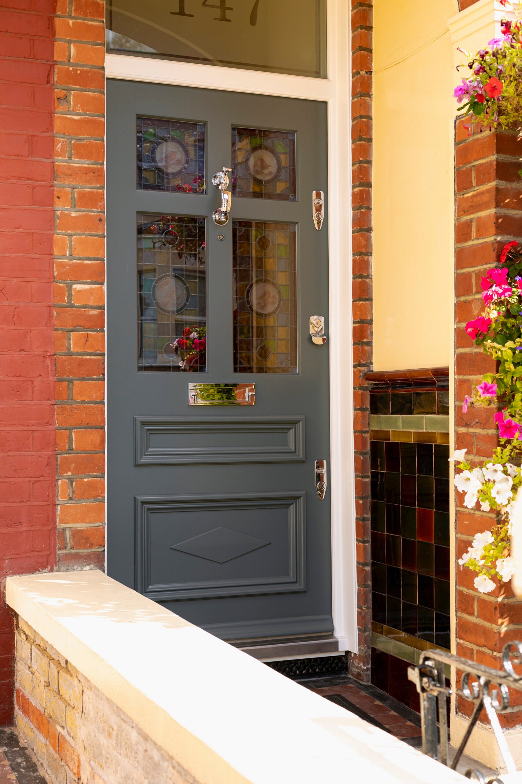 Charcoal grey front door in contemporary entrance