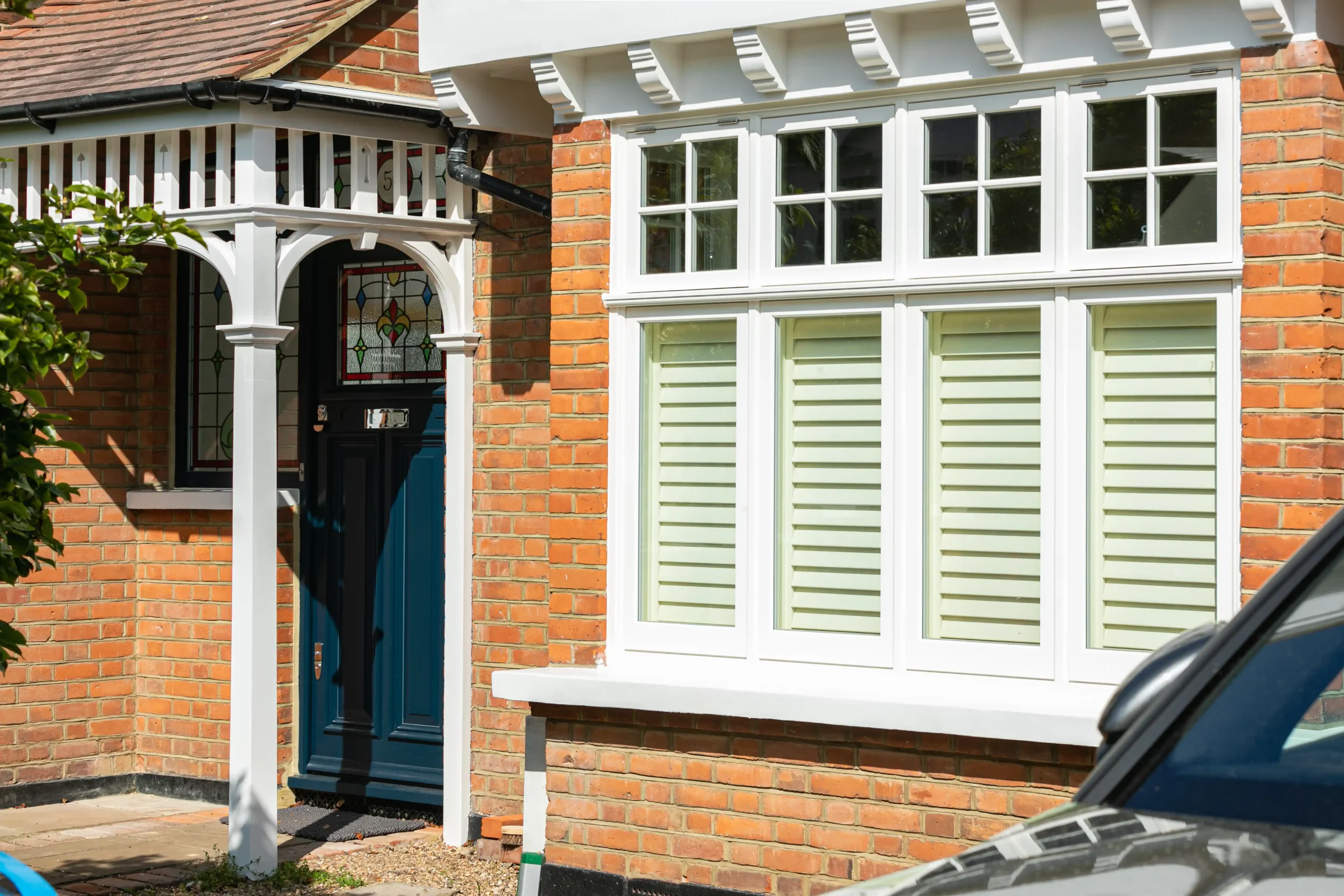 Exterior detail of 1930s style windows with shutters