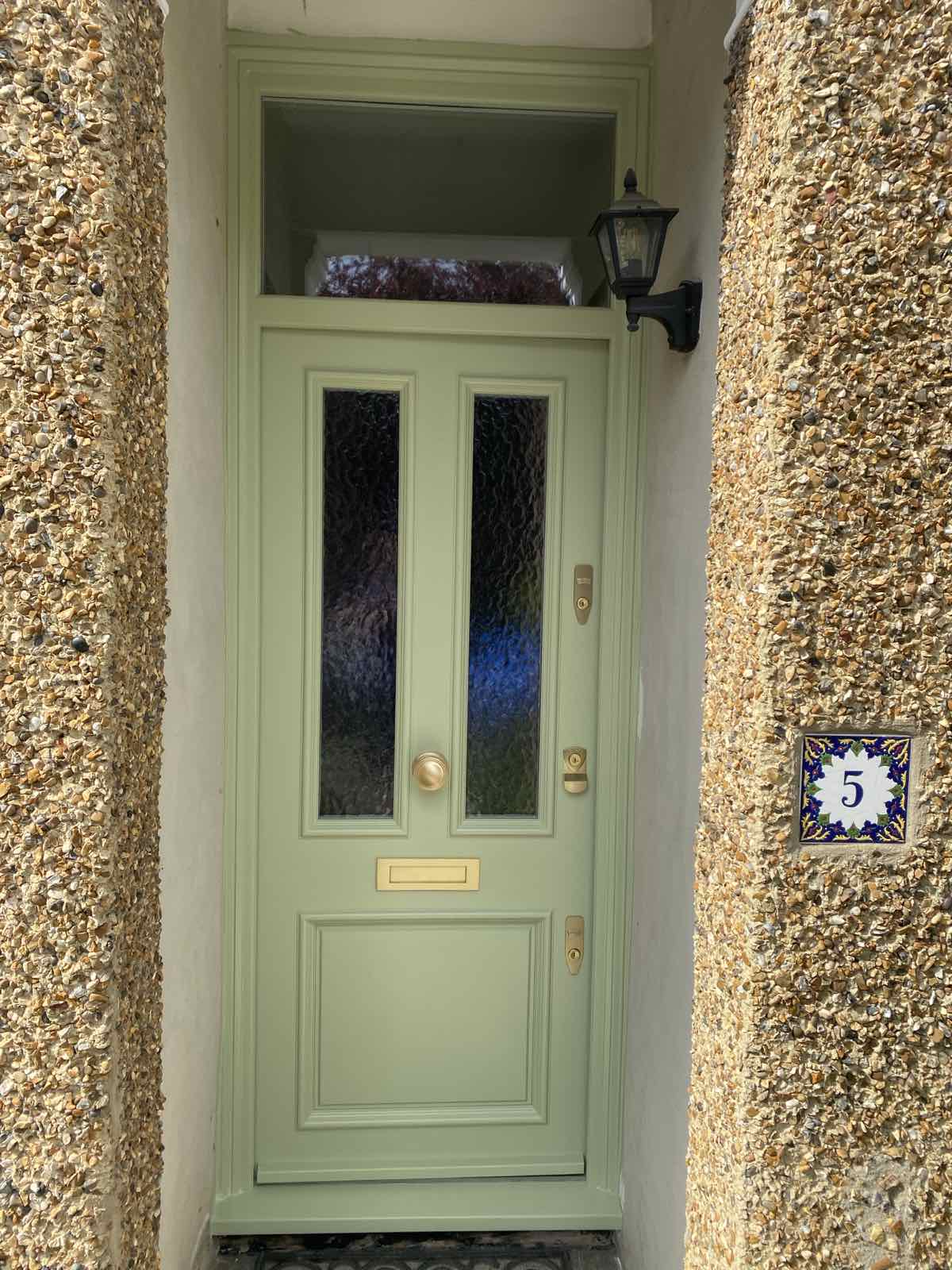 Olive front door and textured walls