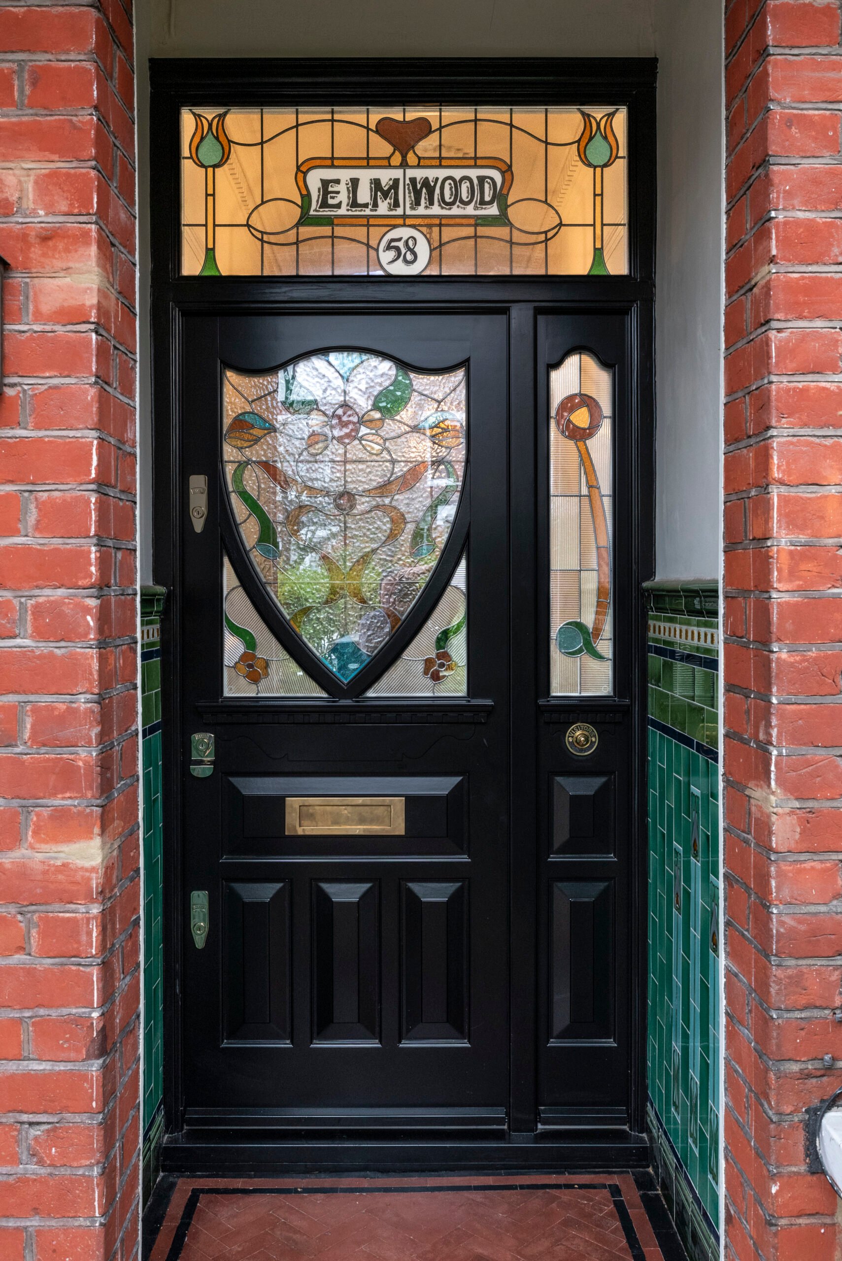 Ornate front door with stained glass