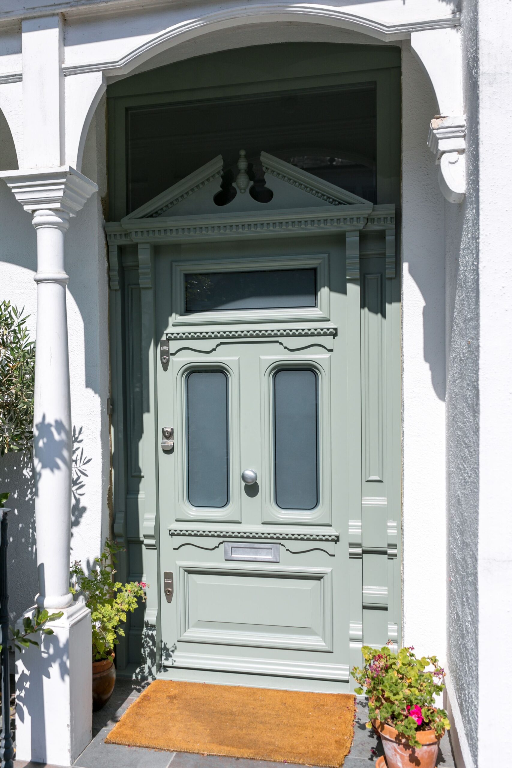 Ornate olive green and white entrance