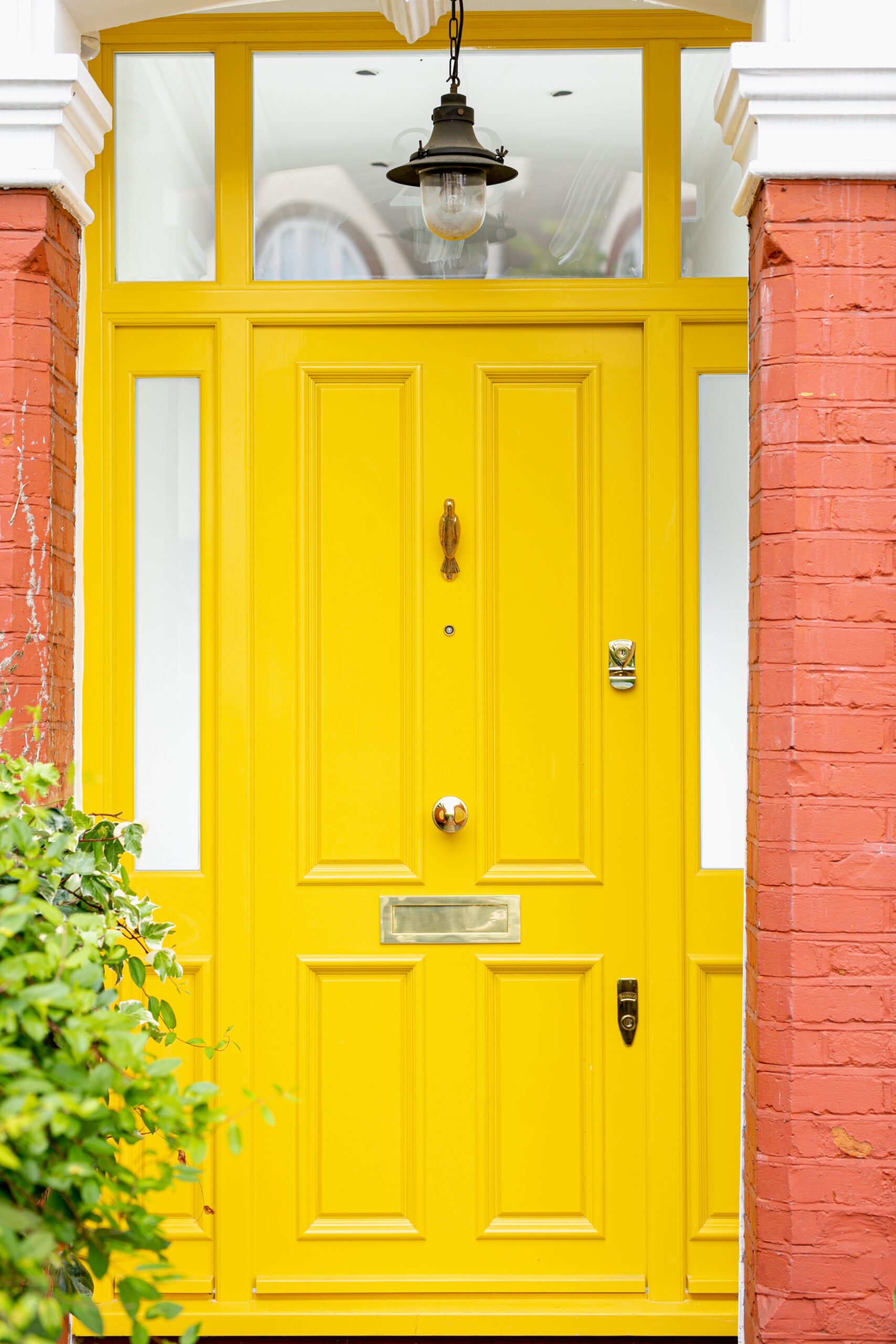 Stylish yellow front door entrace