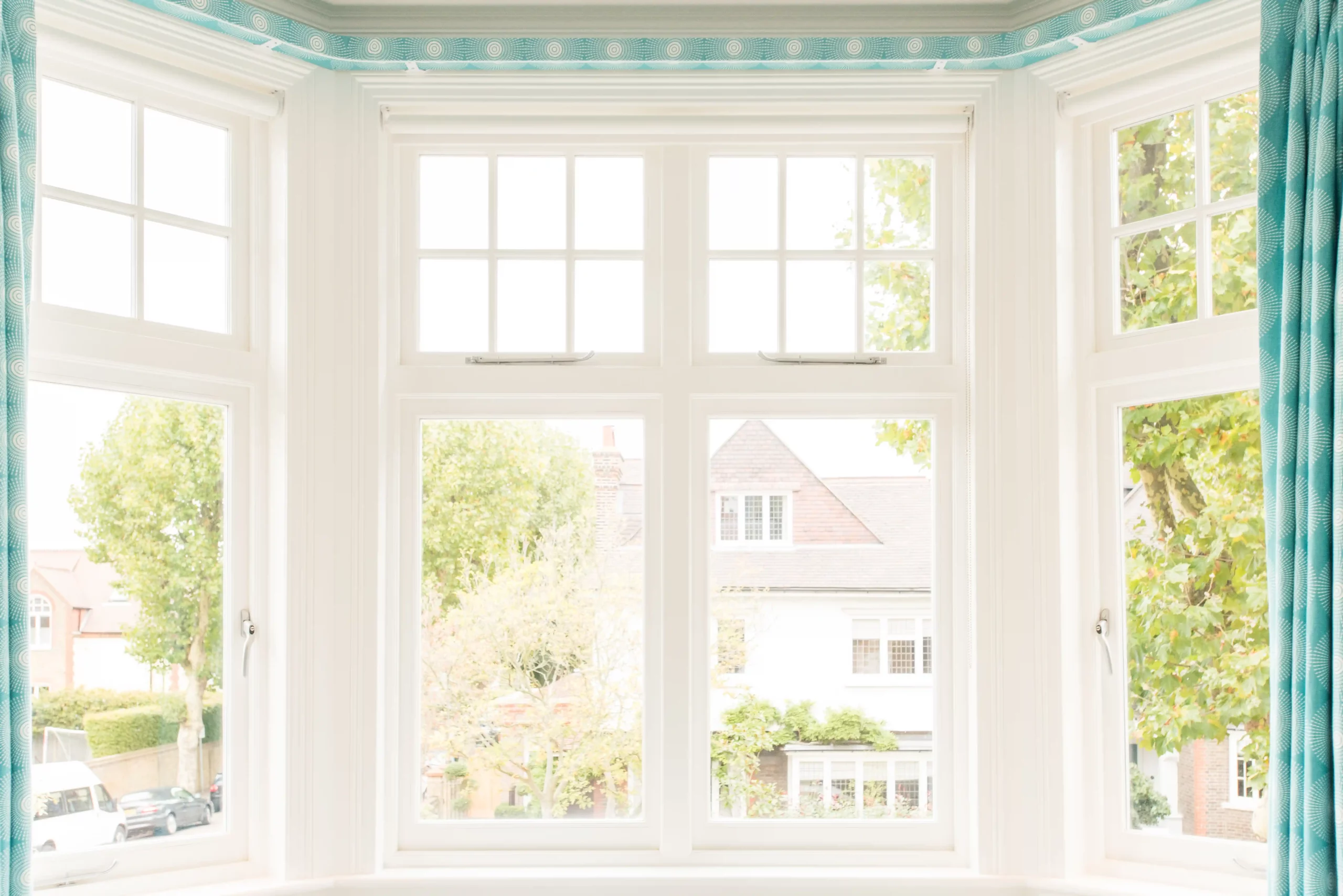White 1930s windows with open side lights