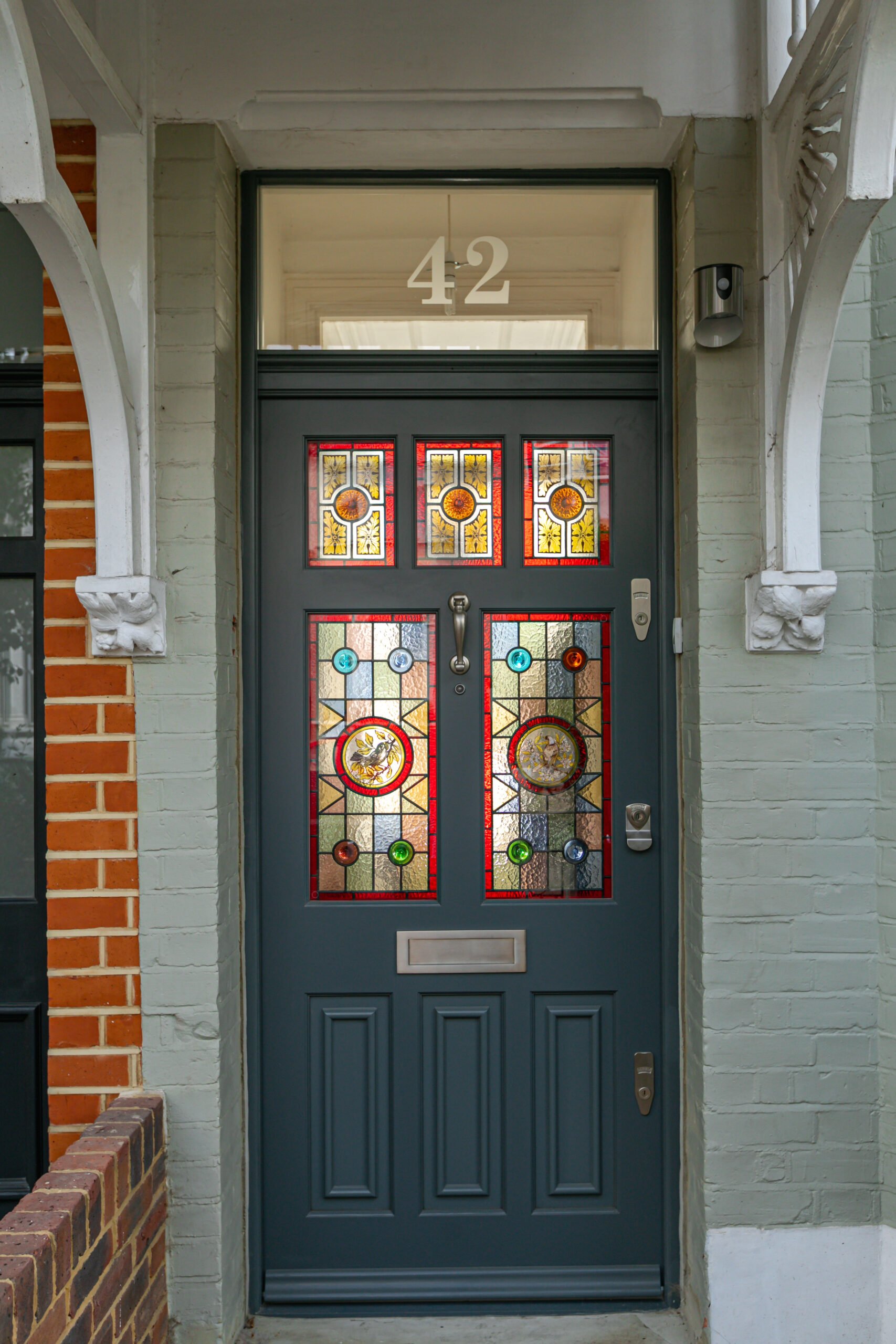 black edwardian front door with stained glass
