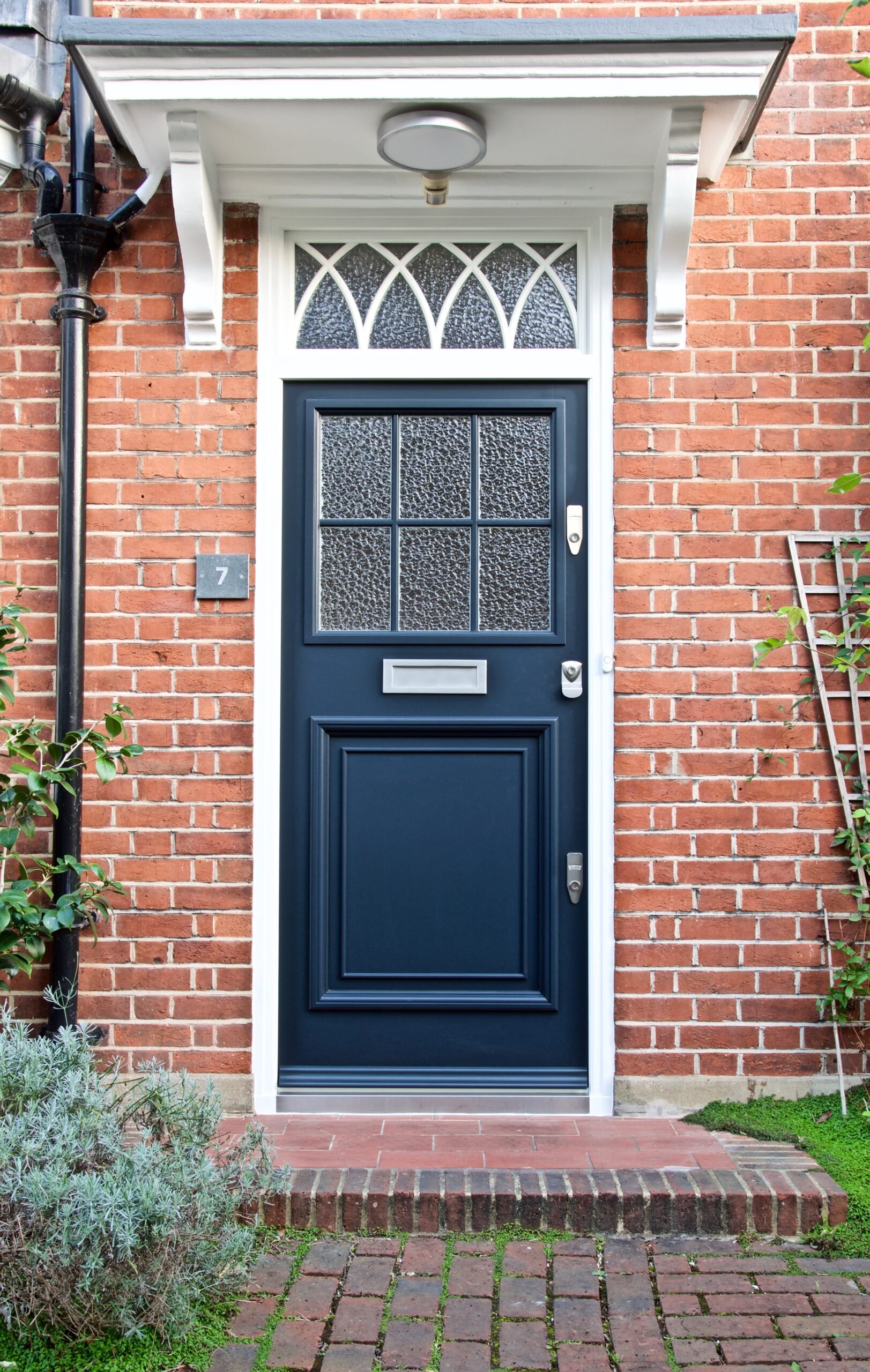 blue 1920s front door with transom windows