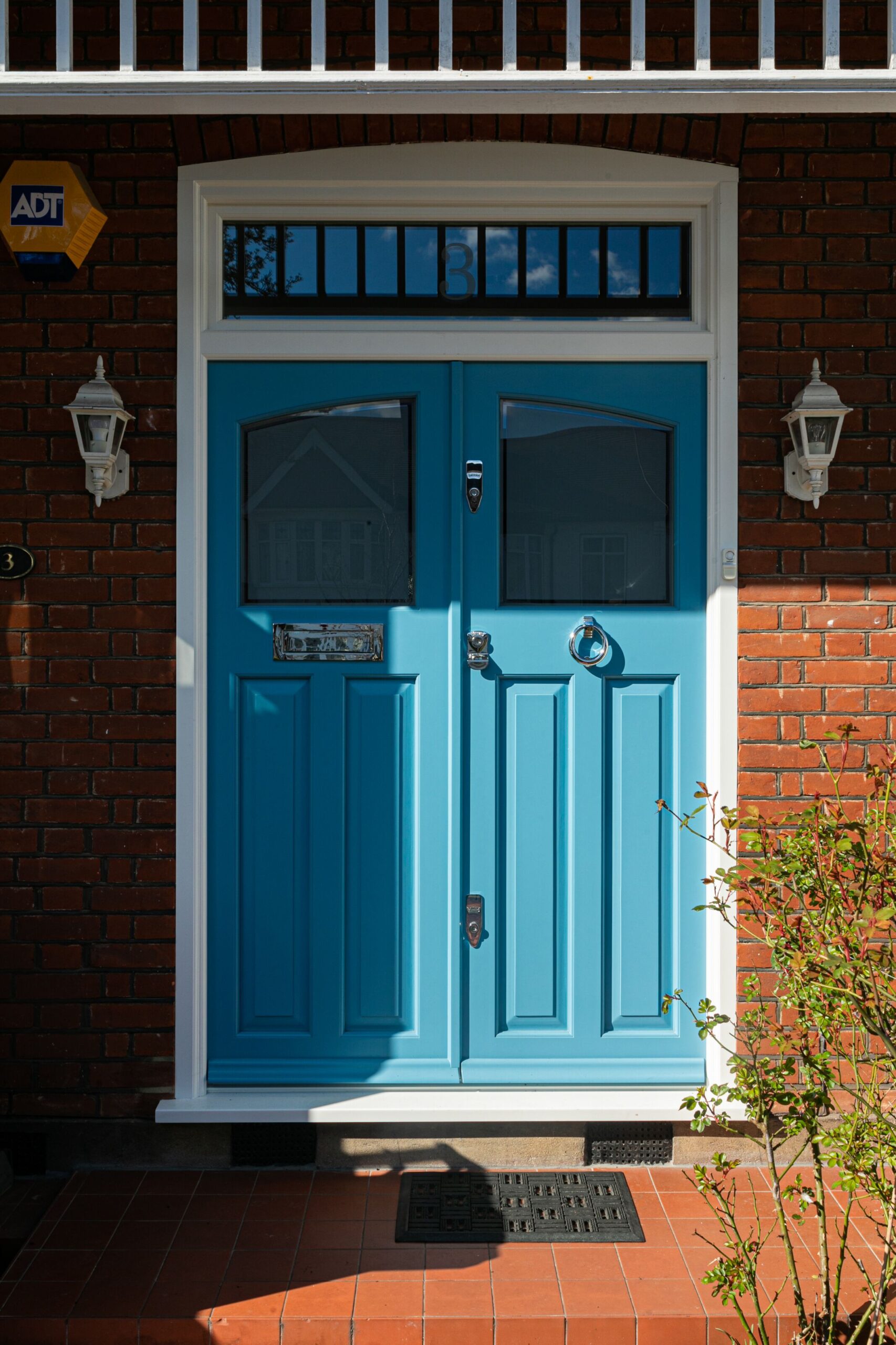 blue 1930s double front doors