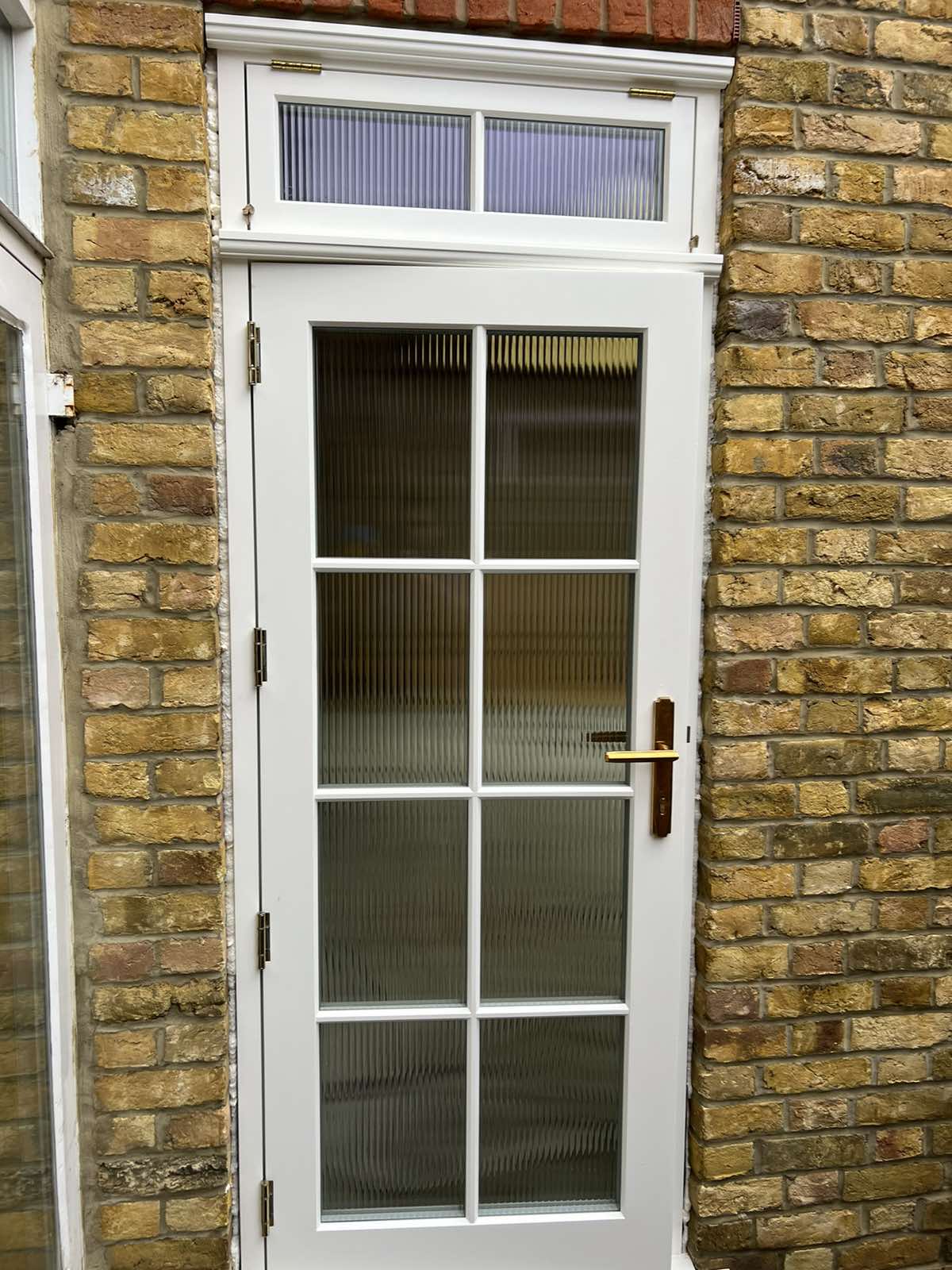 white external door with reeded glass